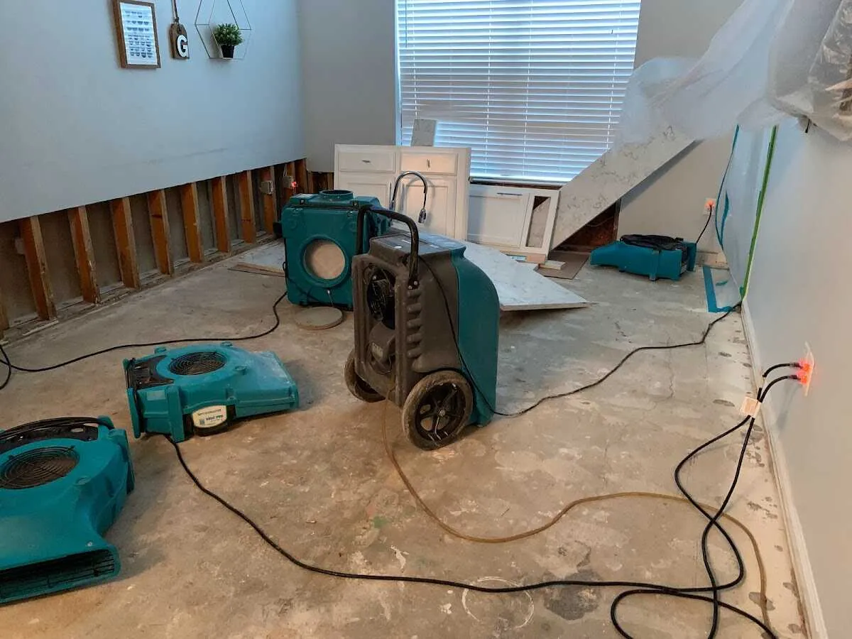 Dehumidifier in flood-cut room for Water Damage Restoration in Fraser